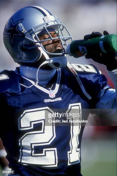 Deion Sanders of the Dallas Cowboys takes a drink during the Cowboys 25-22 loss to the Arizona Cardinals at Sun Devil Stadium in Tempe, Arizona....