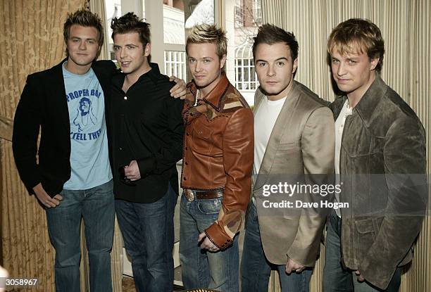 Westlife's Bryan McFadden and his ex band mates pose for the last time with Mark Feehily, Nicky Byrne,Shane Filan and Kian Egan at a press conference...