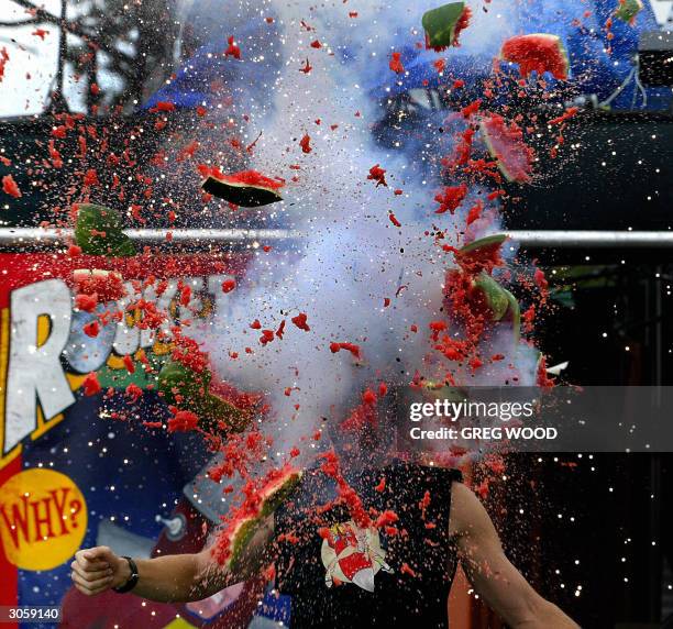 Performer Cosmic Colt , explodes a watermelon which was sitting on a helmet on his head, during a rehearsal for the Daredevil Opera Company's "Rocket...