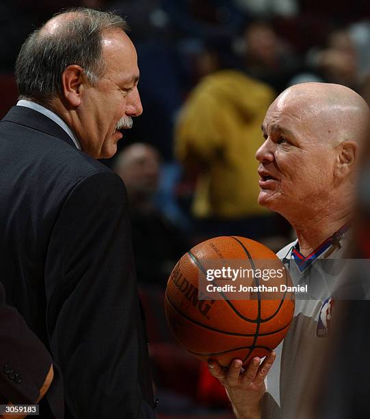 Head coach Chris Ford of the Philadelphia 76ers has a conversation with referee Joey Crawford during a game against the Chicago Bulls on March 9,...