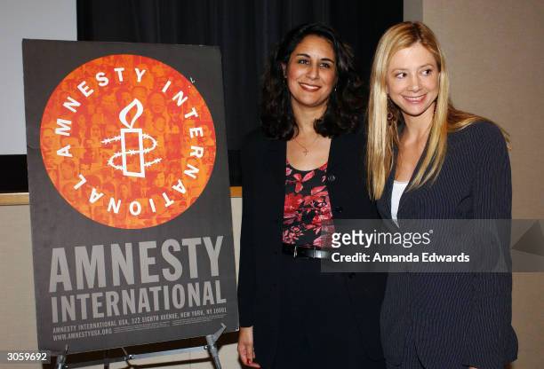 Artists for Amnesty Director Bonnie Abaunza poses with actress Mira Sorvino at Amnesty International's West Coast Launch Event for the International...