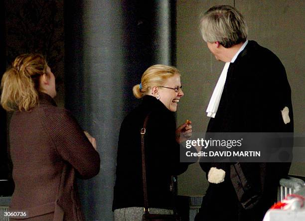 Laetitia Delhez shares a laught with her lawyer Georges-Henri Beauthier at the Arlon court, 10 March 2004. Laetitia, one of two victims who survived...