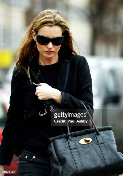 Kate Moss is seen in Notting Hill before meeting an unidentified friend for lunch at Zucca March 10, 2004 in London.