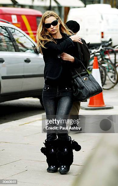Kate Moss is seen in Notting Hill before meeting an unidentified friend for lunch at Zucca March 10, 2004 in London.