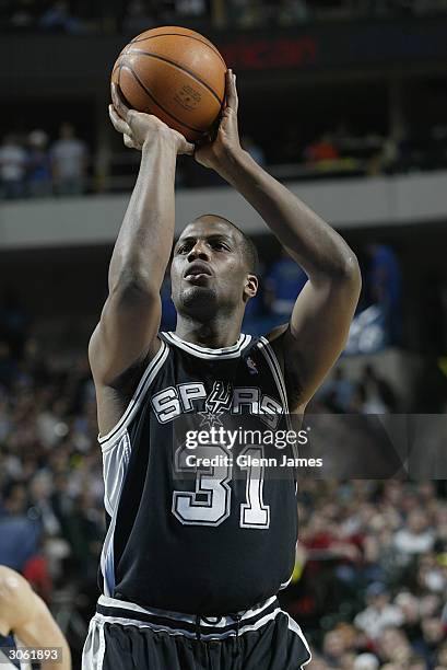 Malik Rose of the San Antonio Spurs shoots a free throw against the Dallas Mavericks during the game at American Airlines Arena on February 26, 2004...