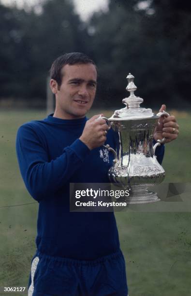 Chelsea Football Club manager Ron Harris holding the FA Cup.