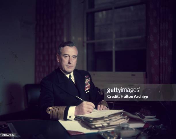 First Sea Lord Louis Mountbatten, Earl Mountbatten, at his office in the Admiralty.