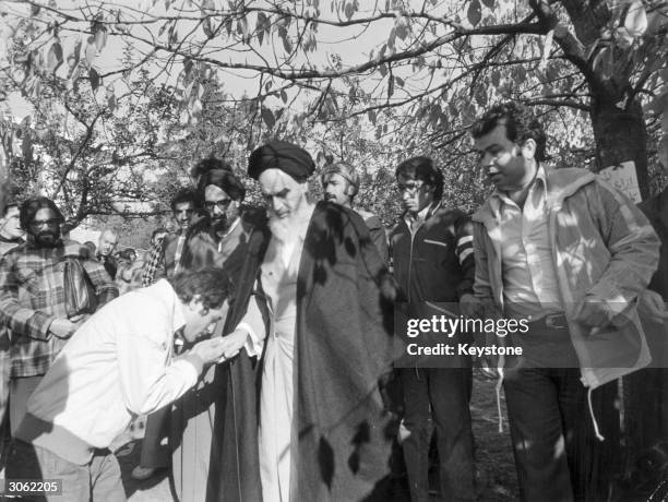 Iranian leader Ayatollah Khomeini in the garden of his French home at Neauphle le Chateau.