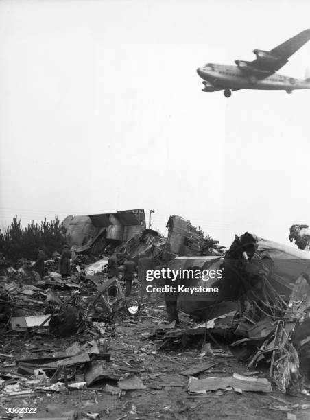 British York aircraft flying over the wreckage of a York transport plane which crashed near Gatow airport during the Berlin airlift.