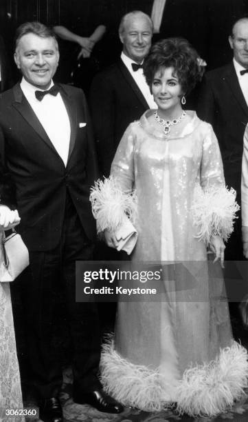 British born actress Elizabeth Taylor with her husband, Richard Burton at Grosvenor House, London, for the BAFTA awards.