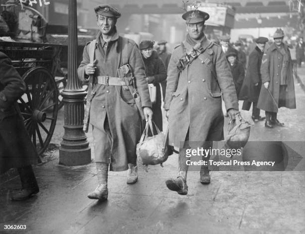 Soldiers arriving at a station in London to travel home for christmas.