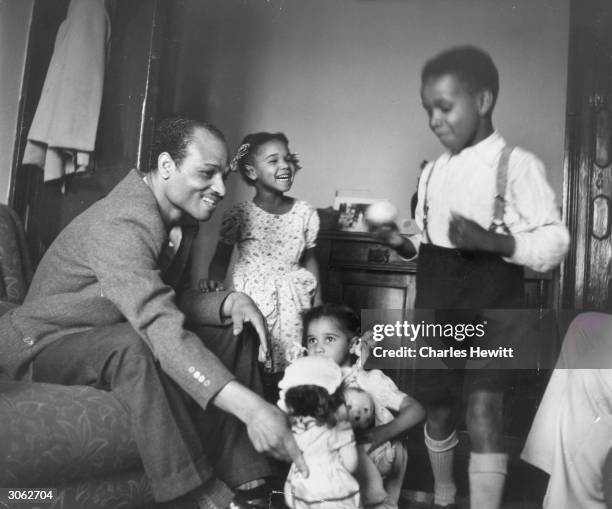 Jamaican father with his young family at their home in Brixton, south London. Original Publication: Picture Post - 6044 - Breeding A Colour Bar -...