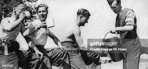 British RAF crewmen relaxing while loading bombers.