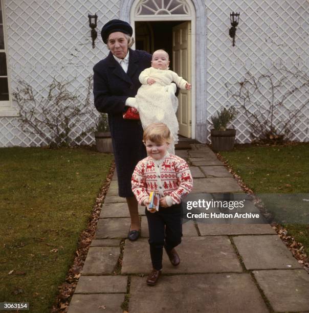 Son of Princess Alexandra of Kent James Ogilvy with his sister Marina and nanny in the grounds of their home, Thatched House Lodge, Richmond Park,...