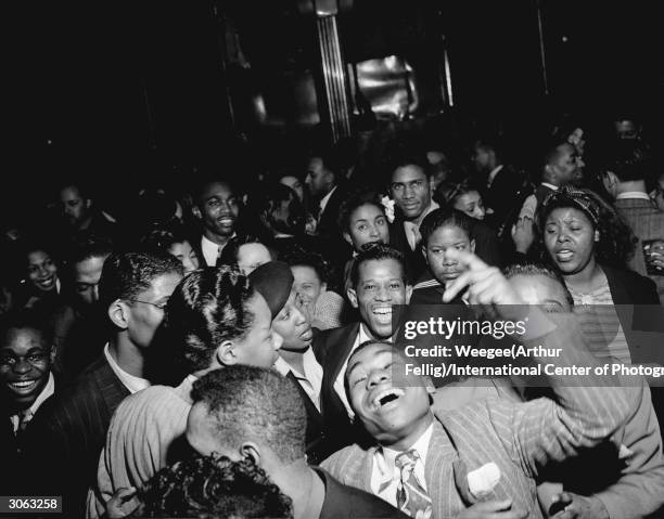 Premium Rates Apply. Circa 1940: A riotous group of partygoers at a New York venue.