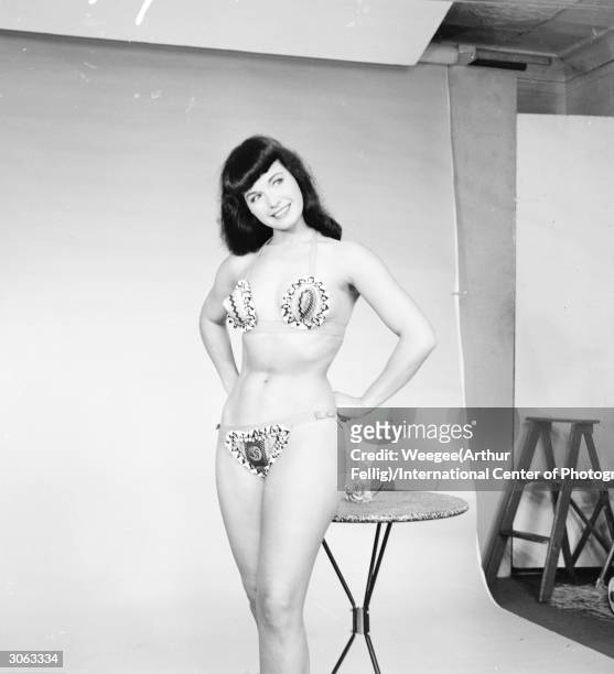 American pin-up Bettie Page, Playboy playmate of the month for January 1955 poses for a glamour shoot, 1950s.
