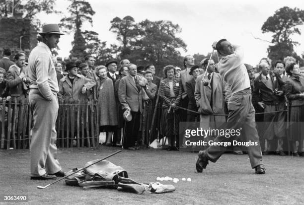 Ryder Cup golfers Sam Snead and Max Faulkner practise before the competition at Wentworth. Original Publication: Picture Post - 6893 - Did We See The...