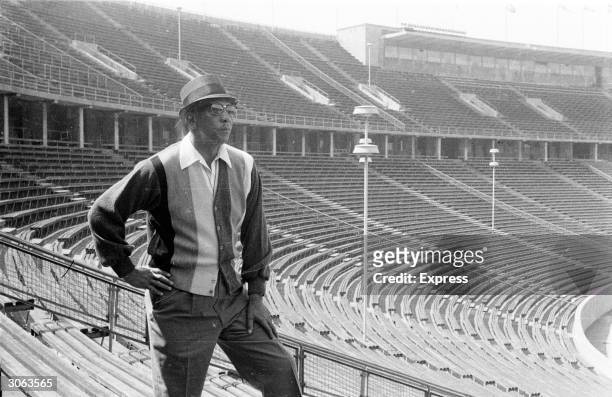 American athlete Jesse Owens , winner of four gold medals at the 1936 Olympic Games revisits the Olympic stadium in Berlin, the scene of his former...