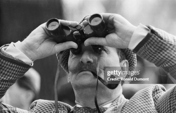Spectator in Hyde Park, London, watching ''Goldie'', the Golden Eagle which escaped from London Zoo.