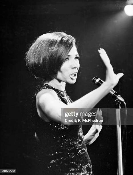 Welsh singer Shirley Bassey performs at the Pigalle nightclub in London.