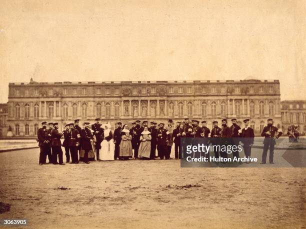 Personnel of the army hospital of the 5th Army Corps outside the Palace of Versailles in France, during the Franco-Prussian War. The palace was...