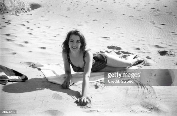 Christine Keeler takes a holiday in Spain shortly before her controversial involvement with war minister John Profumo led to his resignation.