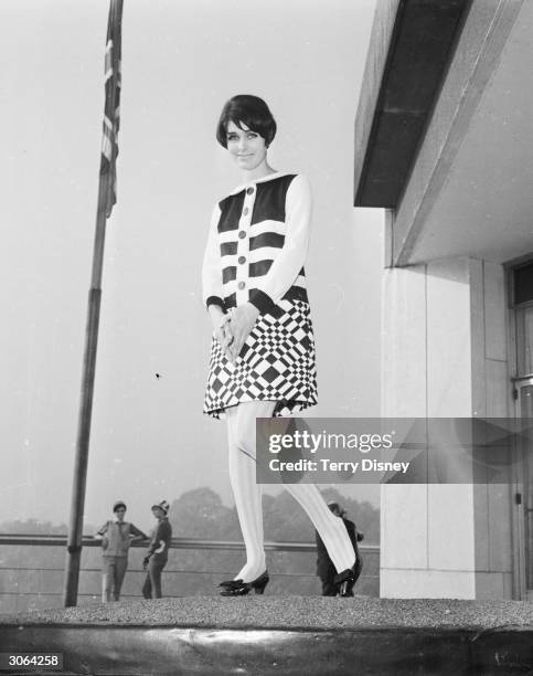 Model Virginia Wonnacott, in a mini-skirt and top ensemble featuring bold geometric patterns, at a fashion show at the Hilton Hotel.