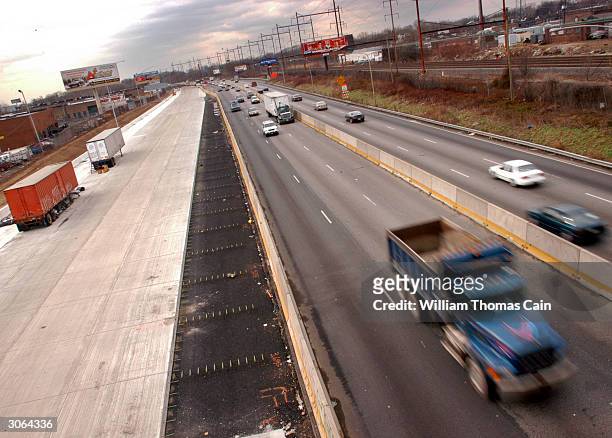 Newly completed northbound two lane portion of Interstate-95 is seen on the left while the four remaining highway lanes are used for north and...