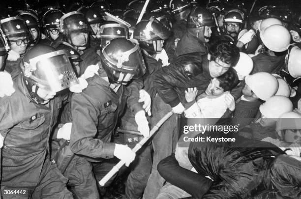 Student is arrested by riot police during a demonstration in Tokyo against the visit to Sasebo of the United States nuclear powered aircraft carrier,...