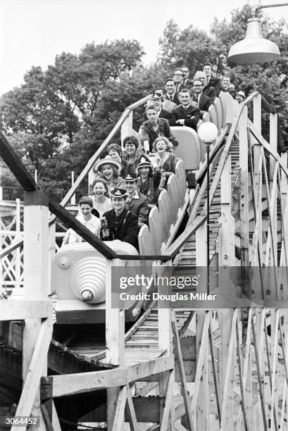 Members of the Russian Bolshoi Ballet company visit the funfair at Battersea Park in London.