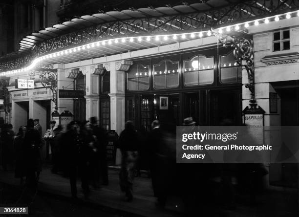 Theatregoers outside the Apollo Theatre, Shaftesbury Avenue, London where 'Espionage' is showing.