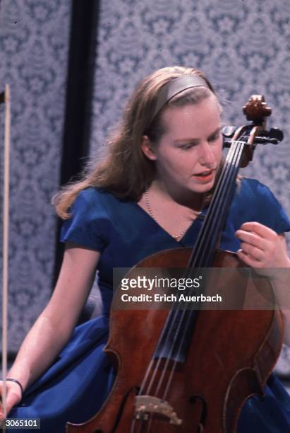 English cellist Jacqueline du Pre pauses during a performance.