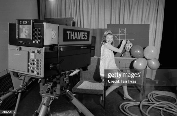 Carole Hersee, the daughter of test card designer George Hersee, posing for a new version of Test Card F at the Thames studios in teddington.
