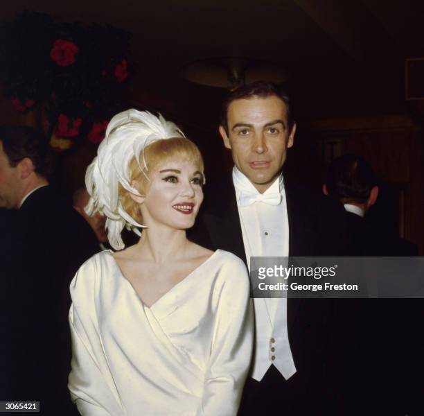 American actress Diane Cilento with her husband Sean Connery at the Royal Film Performance of 'Lord Jim'.