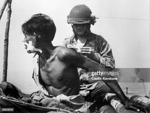 French doctor treating a Vietnamese soldier at Dien Bien Phu.