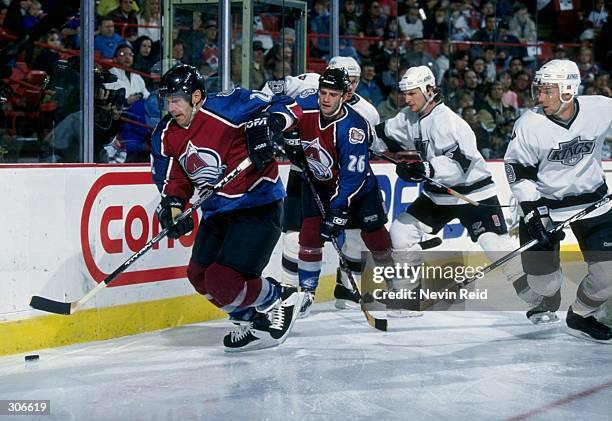 Rightwinger Claude Lemieux and center Stephane Yelle of the Colorado Avalanche in action during a game against the Los Angeles Kings at the McNichols...