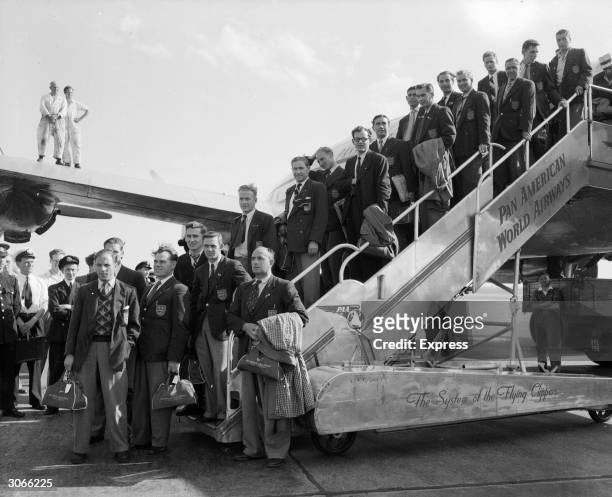 The England football team arrives back at London Airport from Rio after failure in the World Cup. Standing at the bottom of the airplane steps are...