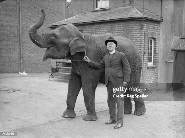 Vicar of Staines J R James is learning to ride an elephant at Surrey Zoo in preparation for the Runnymede Pageant which is to be held on the site of...