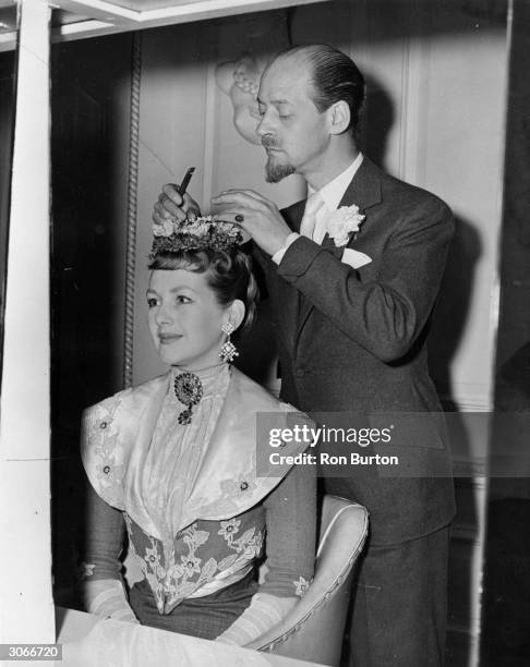 Mrs Gerald Legge has her hair dressed by West End Stylist Steiner for her part in a charity show at the Scala Theatre in London.