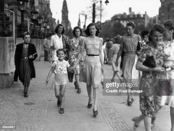 Materials looted from European countries provide clothing for German women who are well dressed compared to women from other countries at the end of...