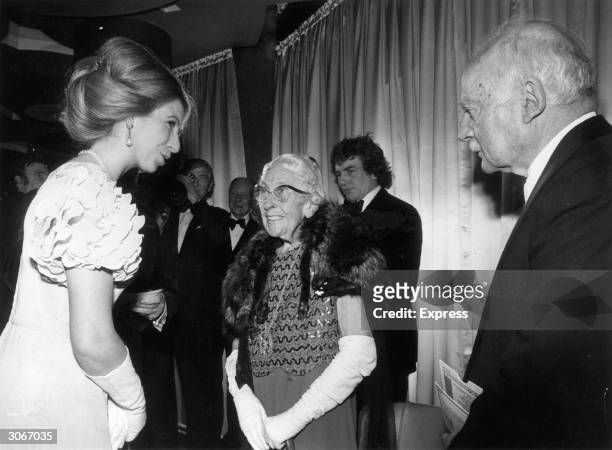 Princess Anne talks to crime writer Agatha Christie and her husband Sir Max Mallowan at the world premier of 'Murder on the Orient Express' at the...