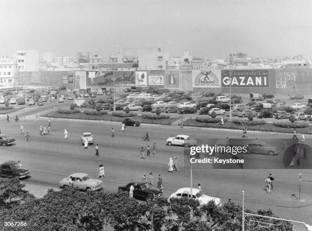 Pedestrians jayalking amongst the traffic in the Place de France, Casablanca.