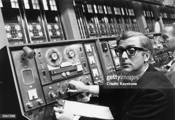 English film star Michael Caine plays the cockney spy Harry Palmer in Harry Saltzman's film 'Billion Dollar Brain'. A Honeywell computer worth...