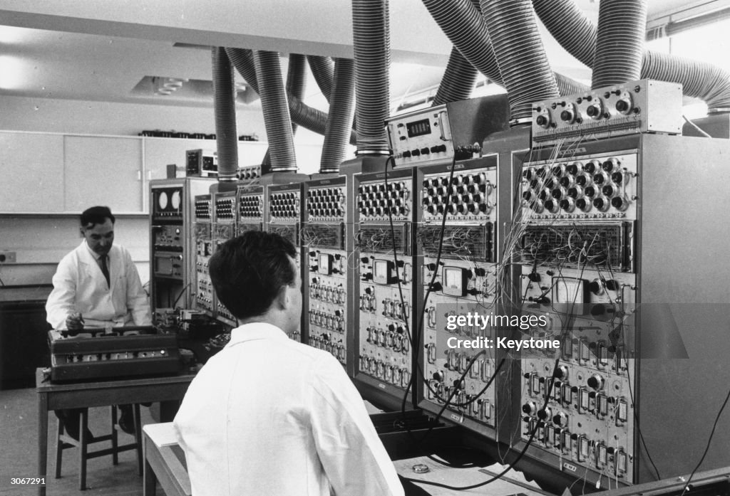 Computer Predicting Newman and E K Sinton use an analogue computer to predict the... News ...