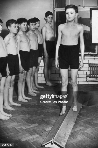 Pupils at Oswin Avenue Senior Boys' School in Doncaster undergo a period of experimental treatment for flat feet and spinal defects, using apparatus...