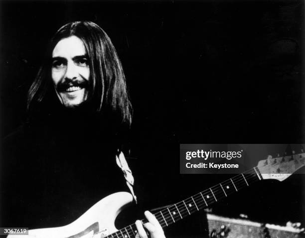 George Harrison of the Beatles at a concert in Copenhagen with Eric Clapton and Delaney and Bonnie.