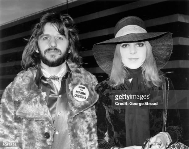 British pop star Ringo Starr with his first wife Maureen at an airport. Ringo's badge refers to the film 'The Magic Christian' in which he starred...