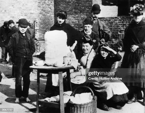 Tea and treacle stall outside a market.