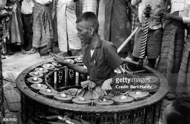 Gamelan being played in Burma, 1950. Original Publication: Picture Post - 4748 - Where Beggars are Becoming Choosers - pub. 3rd June 1950