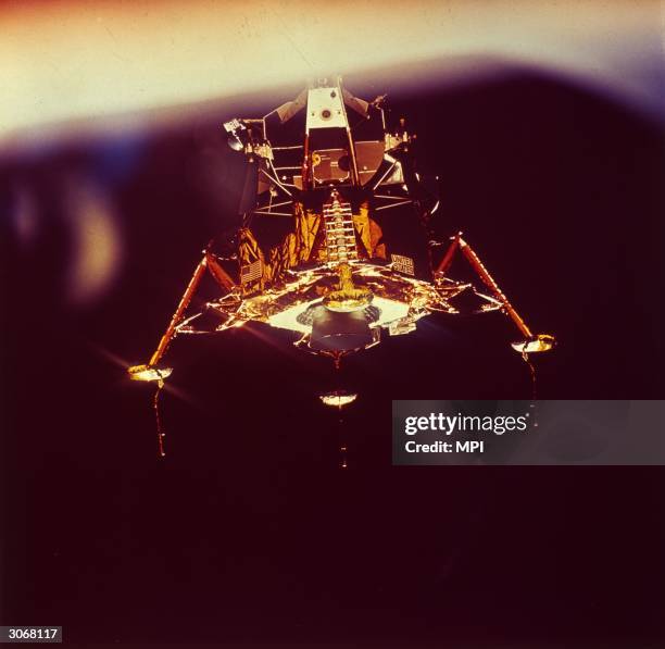 The lunar landing module Eagle descends onto the surface of the moon, carrying Apollo 11 astronauts Edwin 'Buzz' Aldrin and Neil Armstrong....